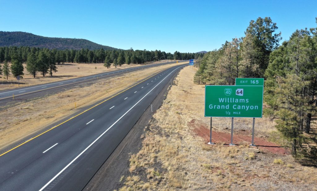 An aerial view of a highway with a sign for Williamson County along Ash Fork - Flagstaff Hwy (I-40).