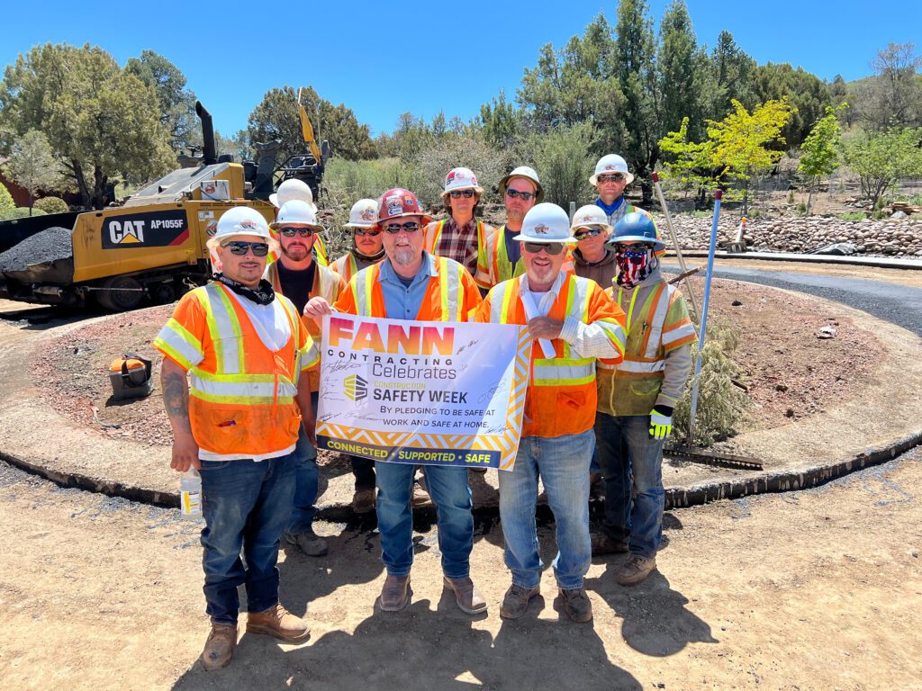 A group of construction workers celebrating Safety Week.