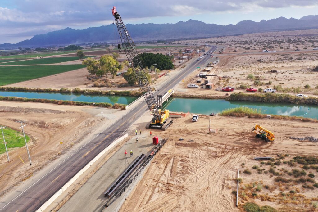 An aerial view of a construction site near a river.