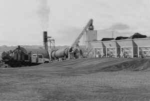 An old black and white photo of a coal plant associated with Fann Contracting.
