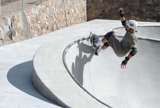 A skateboarder doing a trick at Ken Lindley Park skatepark.