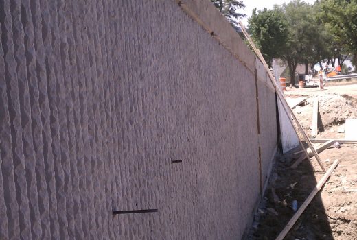 Mt. Vernon Senator Highway Improvements include construction of a concrete wall adjacent to a street.