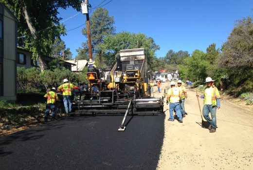 A group of men working on a road.