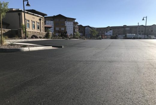 A parking lot in the middle of an apartment complex, part of the Touchmark at the Ranch site infrastructure.