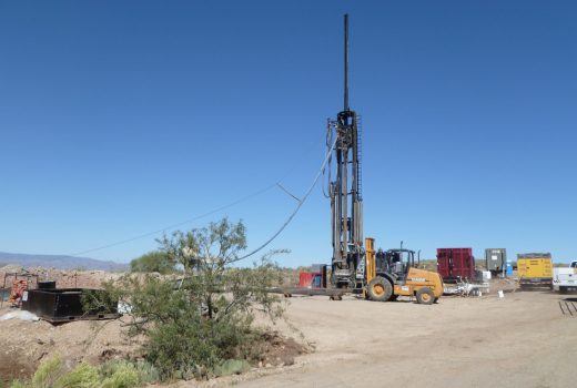 A drilling rig in the desert with a truck at Sunset Point Rest Area on I-17.