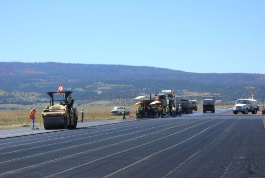 A group of construction workers are rehabilitating Phase V of the Springerville Municipal Airport Runway.
