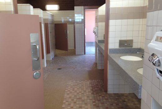 A bathroom at the Burnt Well and Ehrenberg Rest Areas on I-10 with a lot of sinks and mirrors.