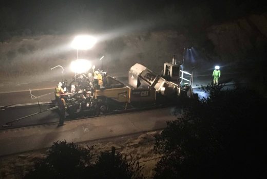 A construction crew is working on Phoenix-Cordes Junction Hwy (I-17) at night.