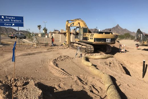 An excavator is working on the Yuma-Casa Grande Highway.