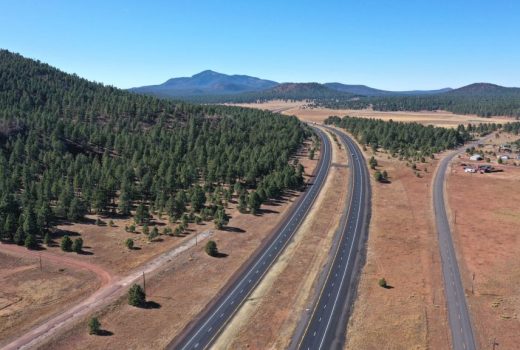 An aerial view of a highway in the mountains near Flagstaff.