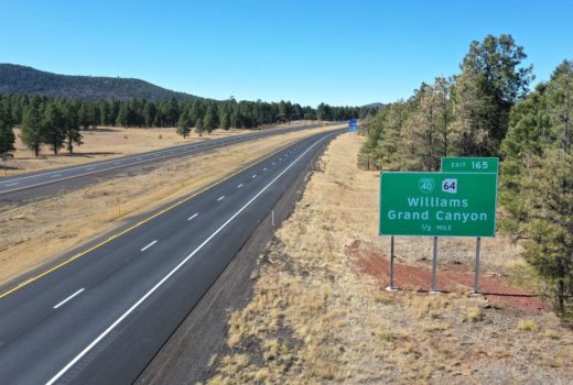 An aerial view of a highway with a sign for Williamson County along Ash Fork - Flagstaff Hwy (I-40).