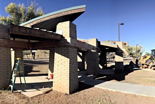 A construction site with a building under construction incorporating Painted Cliffs Rest Areas.