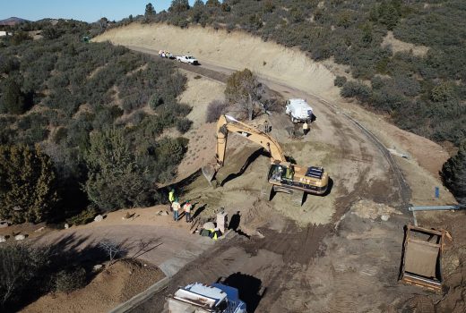An aerial view of a construction site on a hillside.
