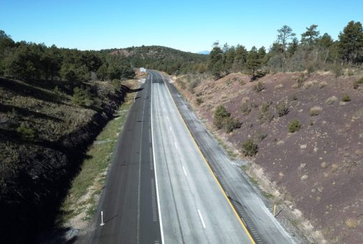 An aerial view of an Ash Fork - Flagstaff Highway (I-40) in the mountains.