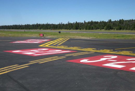 A runway with numbers painted on it at Grand Canyon National Park Airport.